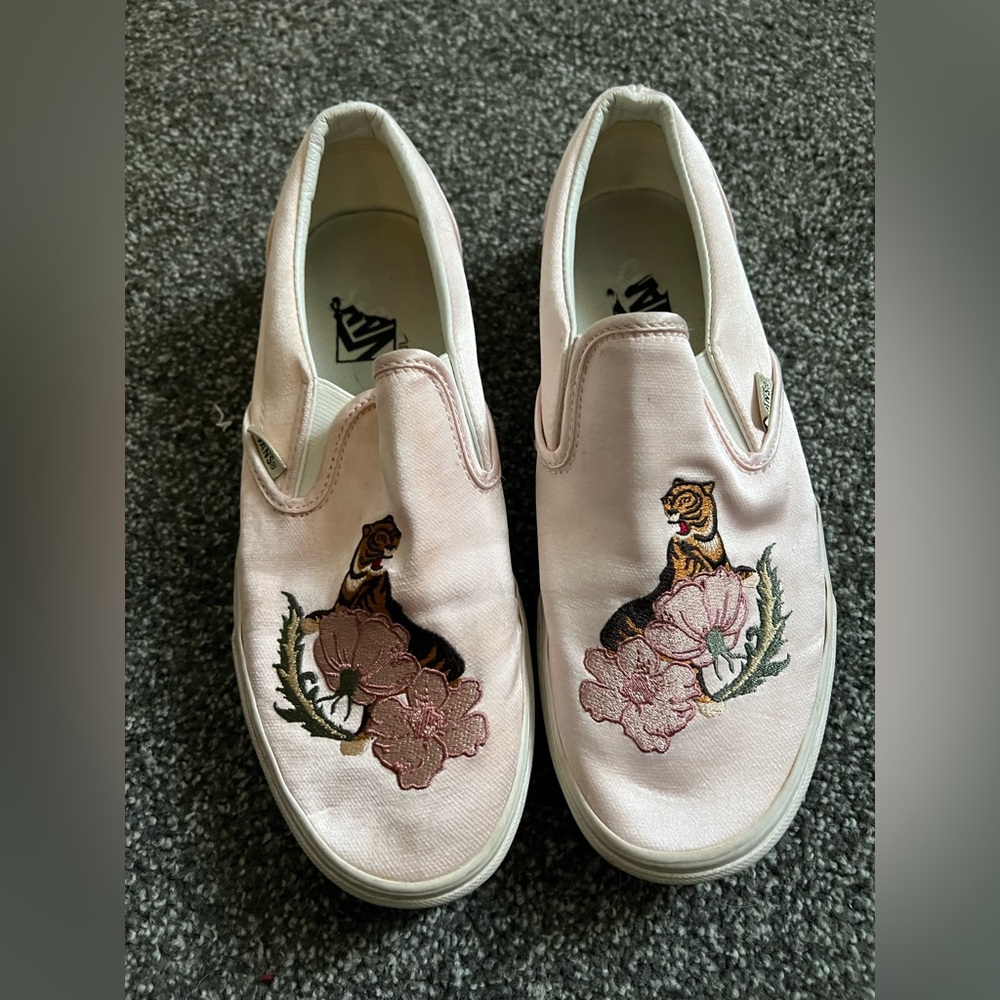 Light pink vans with tiger stitching